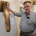 Sigurdur Hjartarson, owner and founder of the Icelandic Phallological Museum, poses next to a stuffed elephant penis at the museum in Husavik.