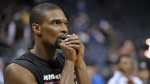 In this Dec. 7, 2014, file photo, Miami Heat center Chris Bosh warms up before an NBA basketball game against the Memphis Grizzlies in Memphis, Tenn. (Brandon Dill / AP Photo)