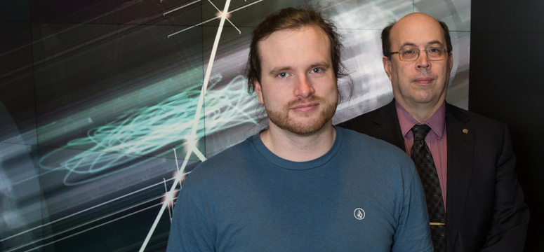 Rob Thompson, right, department head and professor in the Department of Physics and Astronomy in the Faculty of Science and a longtime member of ALPHA, with UCalgary PhD student Andrew Evans. Photo by Riley Brandt, University of Calgary