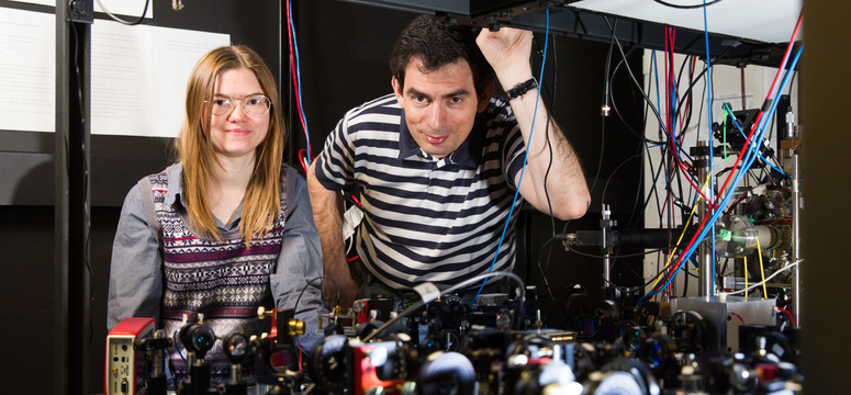Alexander Lvovsky, professor in the Department of Physics and Astronomy, says the development of quantum technologies makes it possible to create increasingly complex quantum states, and Shrödinger’s thought experiment no longer seems too far out of reach. Lvovsky and Anastasia Pushkina, shown here in Lvovsky's UCalgary lab, were part of a Canadian-Russian team of quantum physicists who have found a way to "breed" Shrödinger’s cats that grow ever larger and more energetic. Photo by Riley Brandt, University 