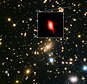 Image of the galaxy cluster MACS J1149.5+2223 (highlighted inset, oxygen distribution shown in red). Light from the galaxy has been travelling across space for 13.28 billion years. (LMA (ESO/NAOJ/NRAO), NASA/ESA Hubble Space Telescope, W. Zheng (JHU), M. Postman (STScI), the CLASH Team, Hashimoto et al/PA)