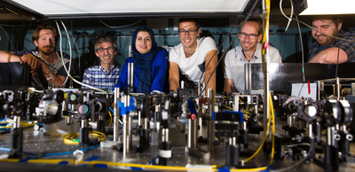 Nine graduate students and post-doctoral researchers from Simon’s and Tittel’s group worked on the experiment. Some of the team, from left: Daniel Oblak, Christoph Simon, Parisa Zarkeshian, Marcel.li Grimau, Wolfgang Tittel, and Pascal Lefebvre. 